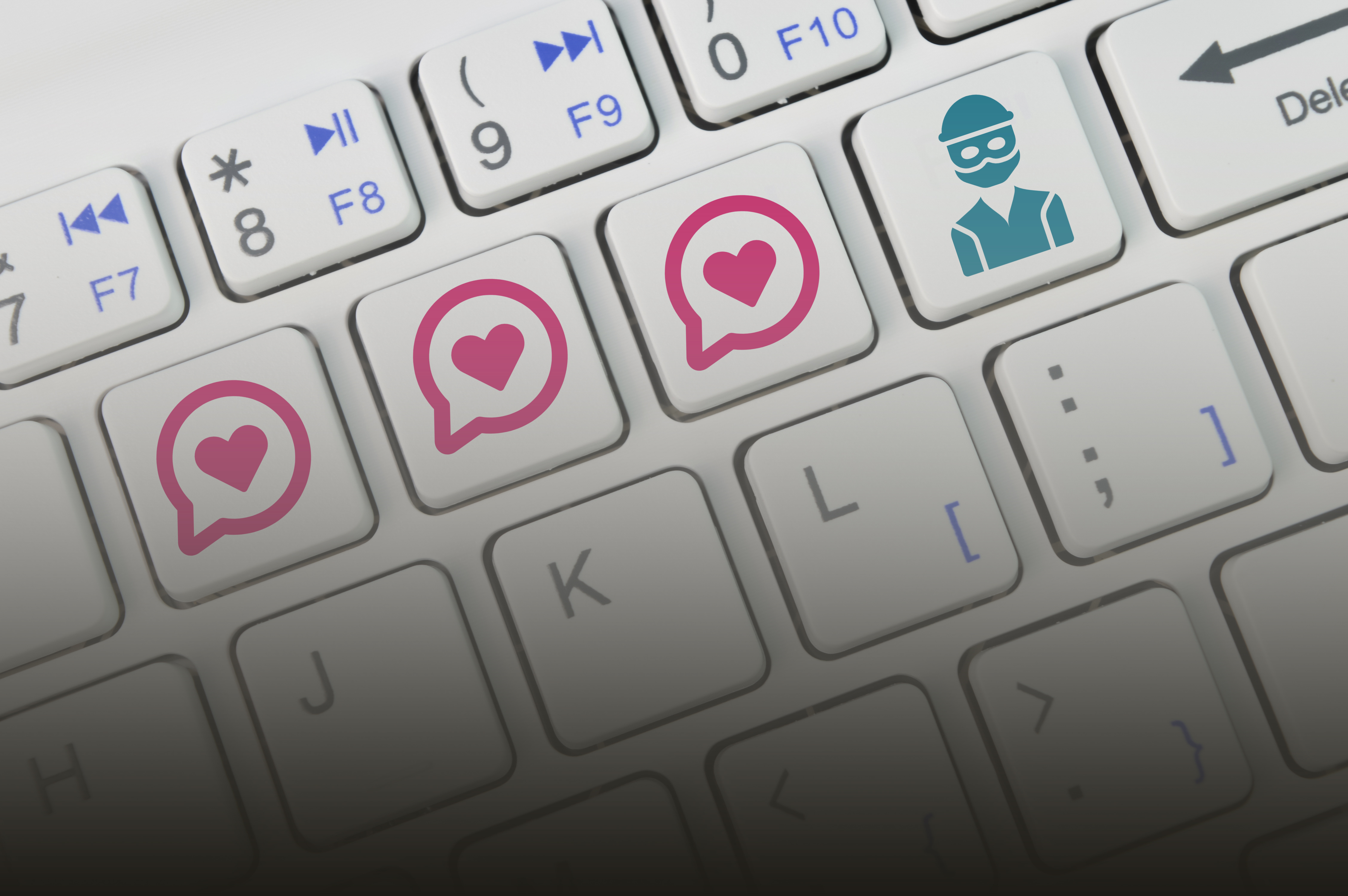 An image showing a computer keyboard. As well as heart icon keys, the keyboard features a key with an image representing a thief.