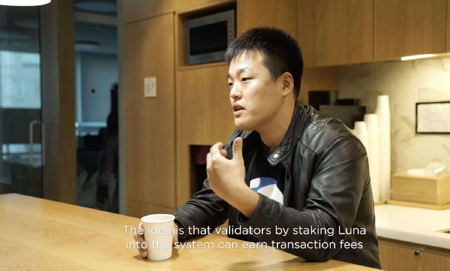 The Terraform CEO Do Kwon, sitting at a table.