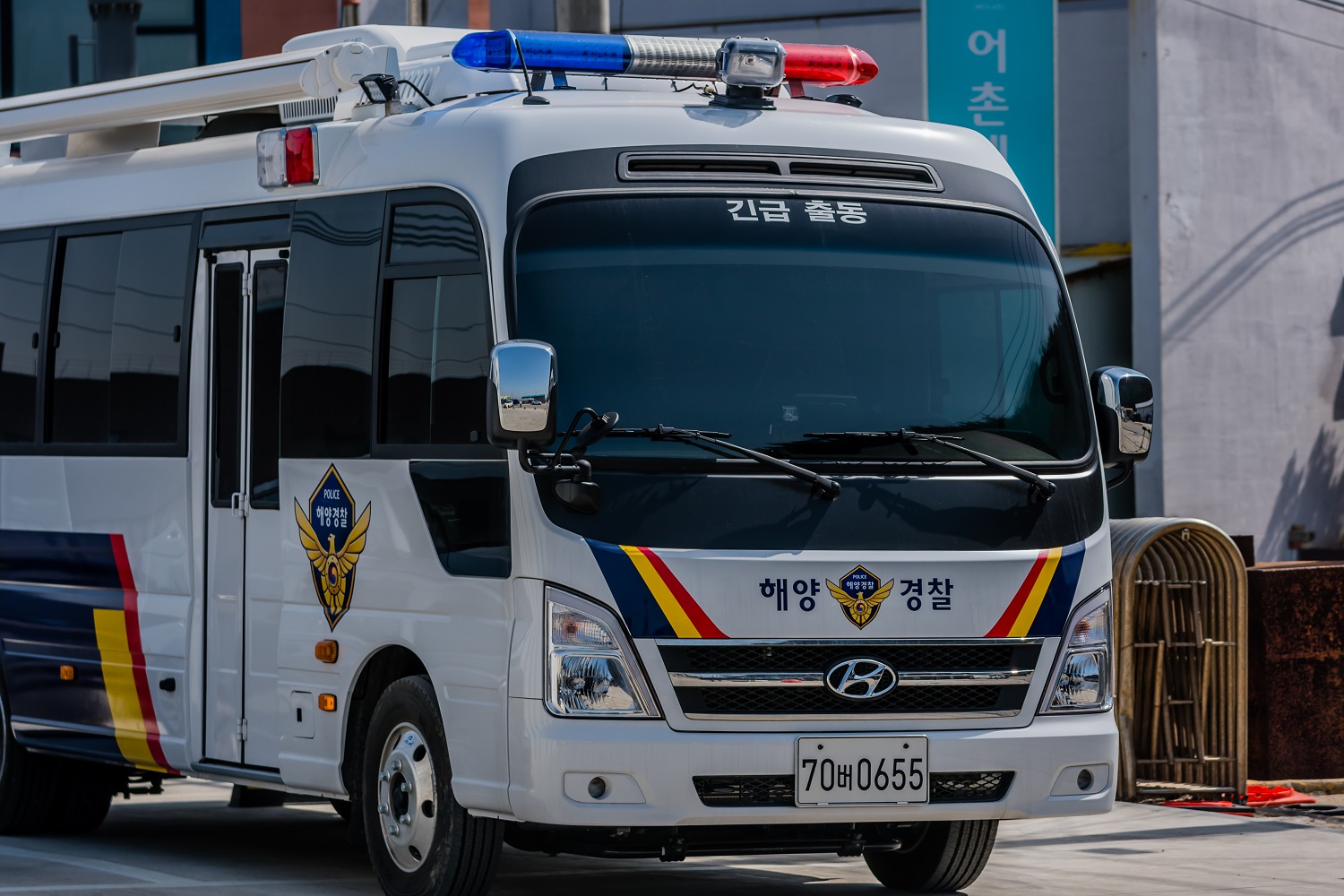 A South Korean police bus on a city street.