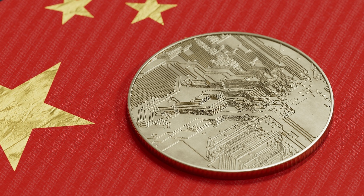 Kim loại token dự định đại diện cho một loại tiền điện tử nằm trên lá cờ của Trung Quốc.